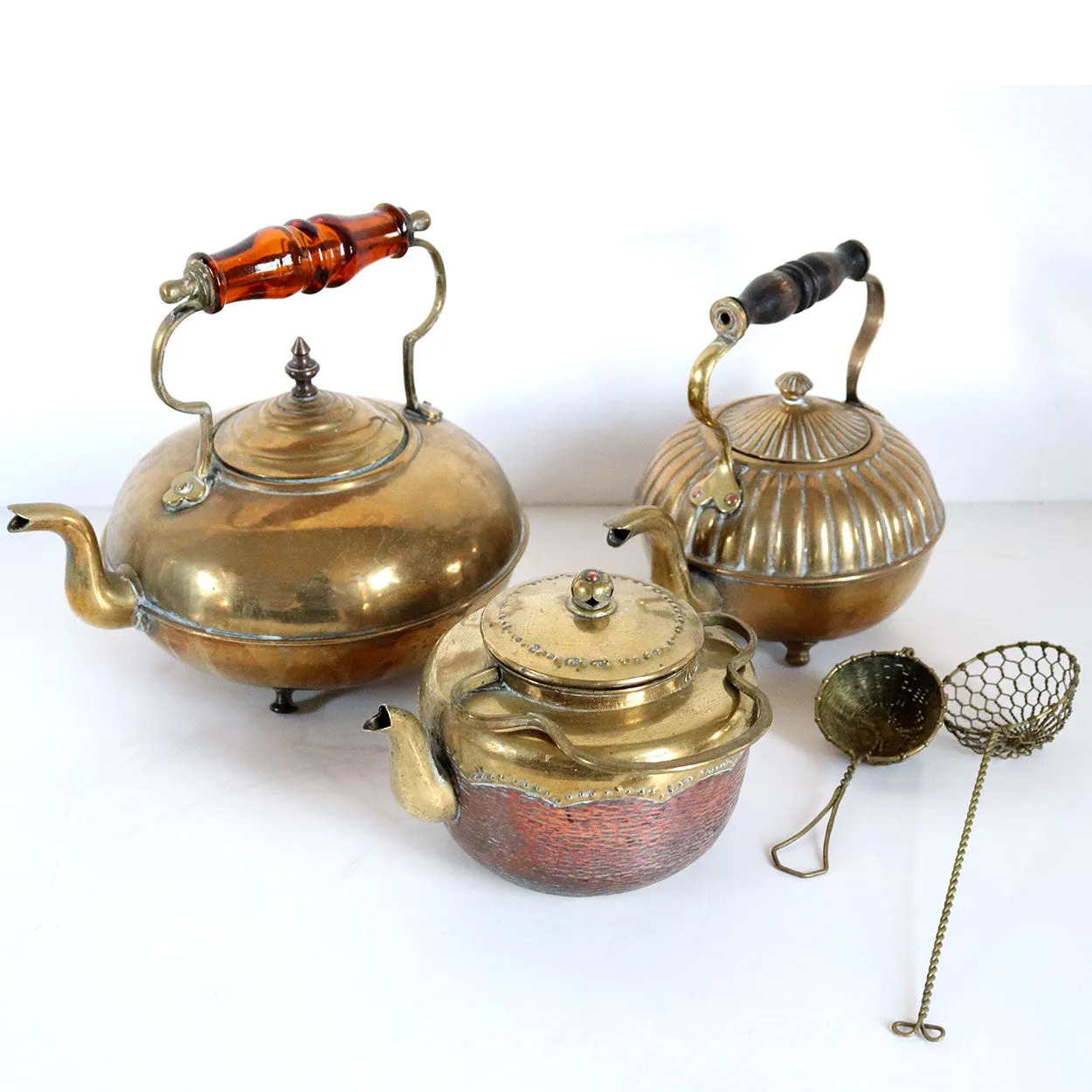 Three English and Chinese Brass and Copper Teapots and Two Strainers